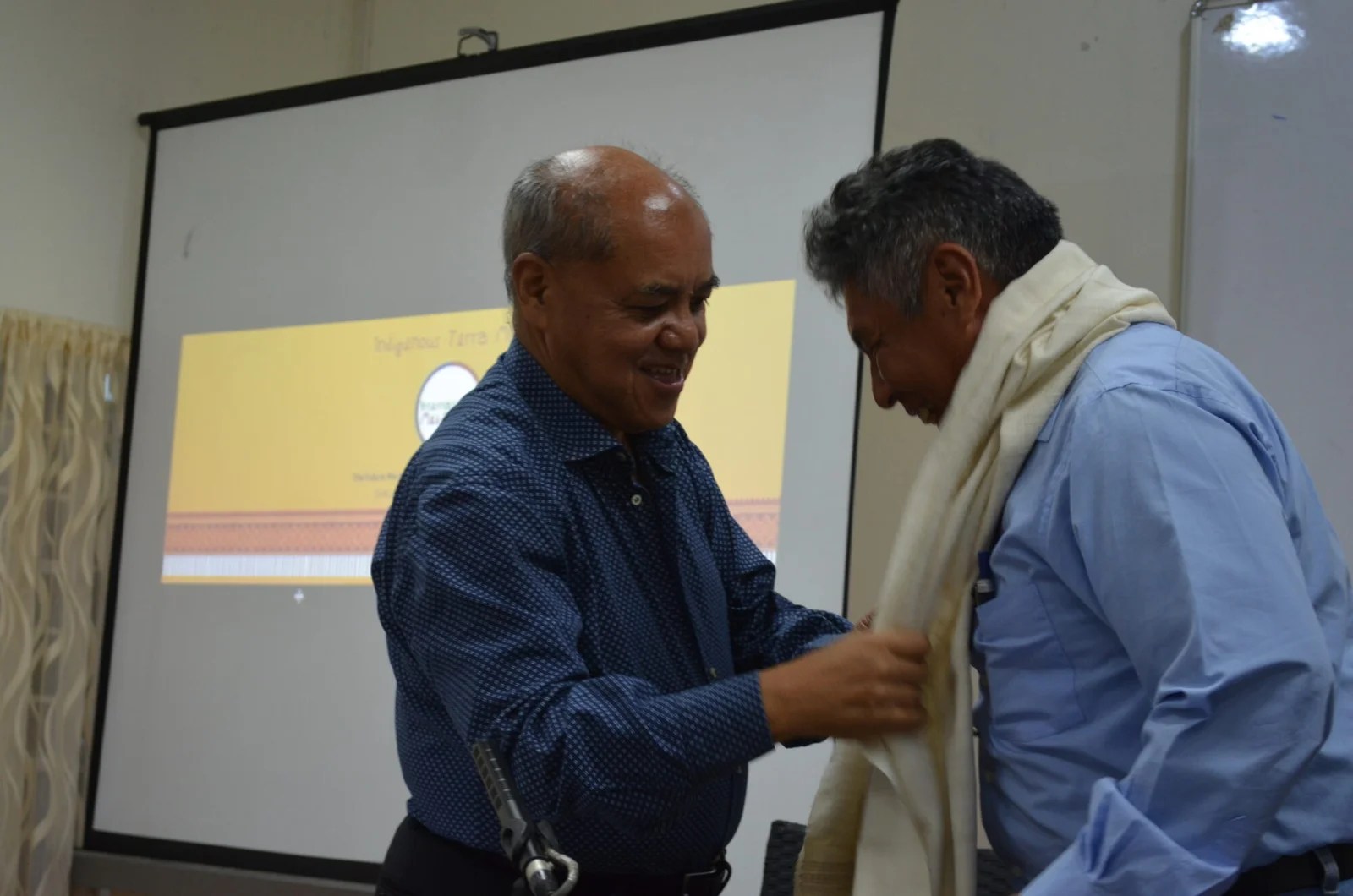 Shri Phrang Roy, Chairman NESFAS, honours and thanks Dr.Francisco Rosado may with a Ryndia Shawl from village community of Rhiboi district.